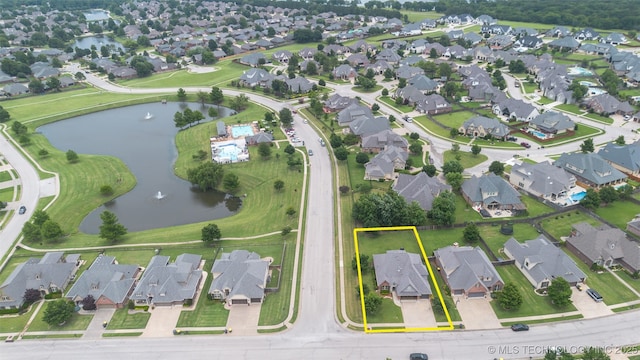 113 E 128th St S, Jenks, OK 74037 - aerial view of property's location featuring nearby suburban area, a nearby body of water, and property parcel outlined