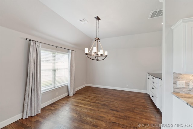 113 E 128th St S, Jenks, OK 74037 - unfurnished dining area with a chandelier, dark wood-style flooring, and lofted ceiling