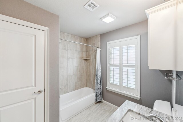 113 E 128th St S, Jenks, OK 74037 - full bath featuring shower / bath combo with shower curtain and baseboards