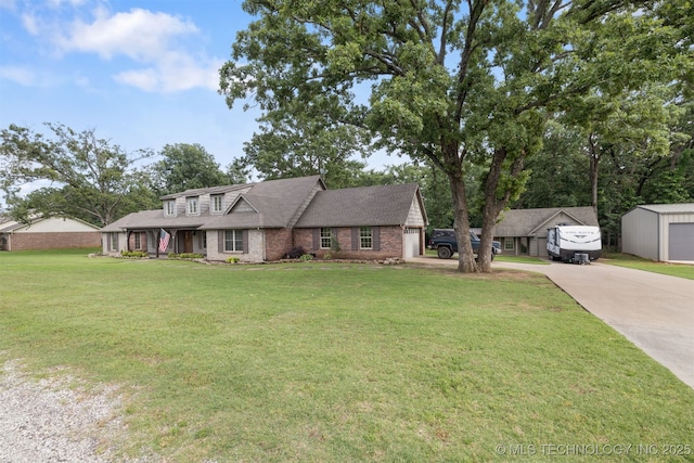 209 Shell Ln, Durant, OK 74701 - view of front facade featuring driveway, a front yard, brick siding, and a shingled roof