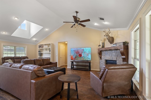 209 Shell Ln, Durant, OK 74701 - living area featuring a skylight, a fireplace, a ceiling fan, dark wood-style flooring, and lofted ceiling