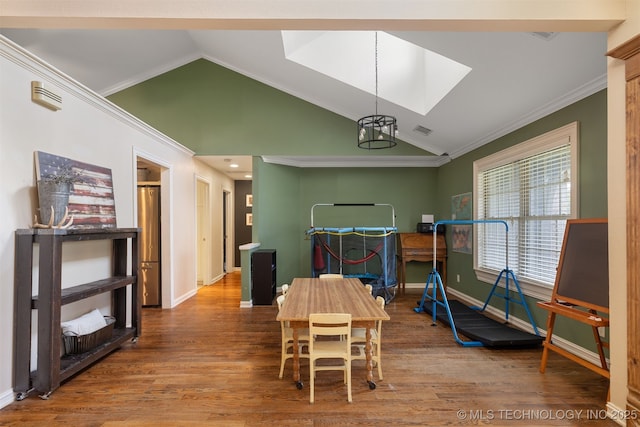 209 Shell Ln, Durant, OK 74701 - dining space featuring wood finished floors, vaulted ceiling, crown molding, and a chandelier