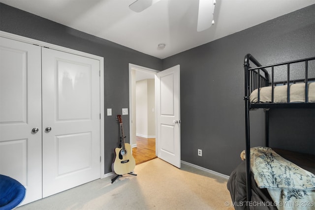 209 Shell Ln, Durant, OK 74701 - bedroom featuring light colored carpet, a closet, and a ceiling fan