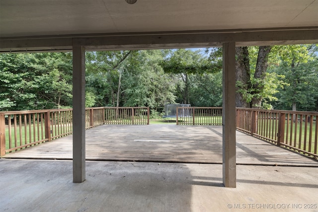 209 Shell Ln, Durant, OK 74701 - view of patio / terrace with a trampoline, a deck, and view of scattered trees