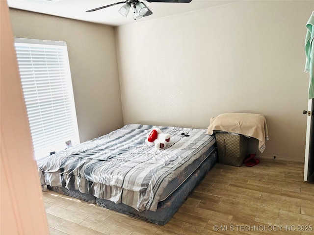 7936 S 72nd E Ave, Tulsa, OK 74133 - bedroom with wood finished floors and ceiling fan