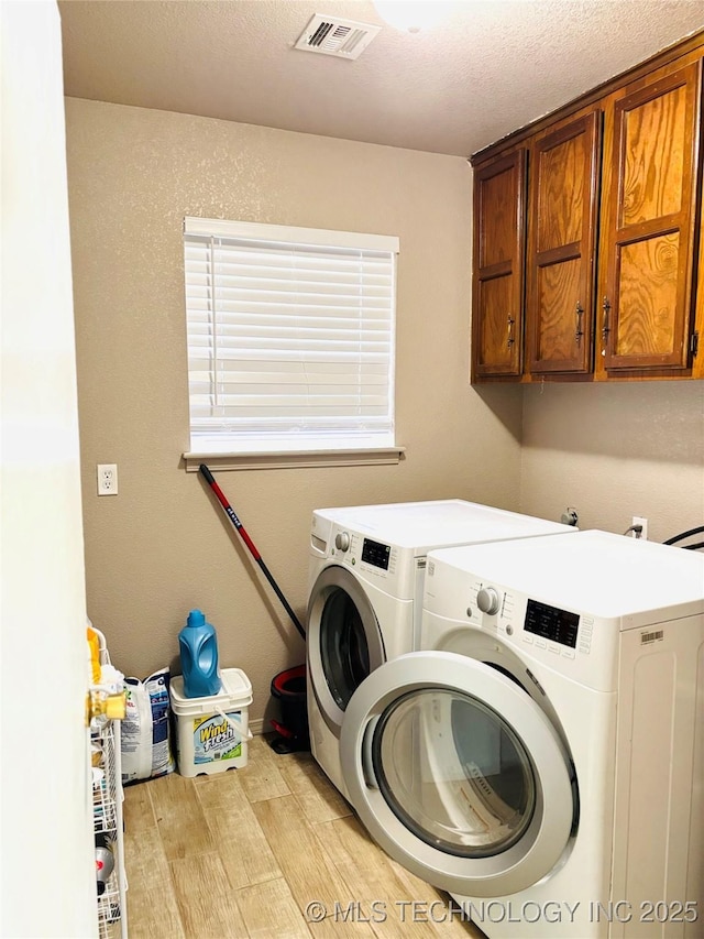 7936 S 72nd E Ave, Tulsa, OK 74133 - laundry area featuring washer and clothes dryer, cabinet space, and light wood-type flooring