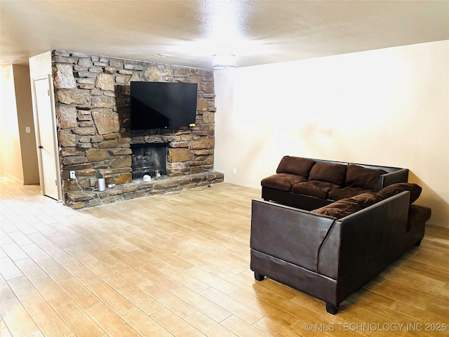 7936 S 72nd E Ave, Tulsa, OK 74133 - living area with wood finished floors and a stone fireplace