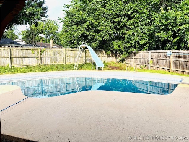 7936 S 72nd E Ave, Tulsa, OK 74133 - view of swimming pool featuring a water slide, a fenced backyard, and a patio