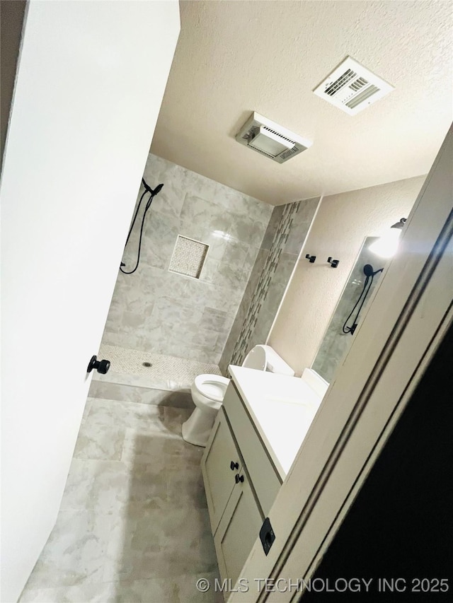 7936 S 72nd E Ave, Tulsa, OK 74133 - full bath featuring vanity, a shower stall, and a textured ceiling