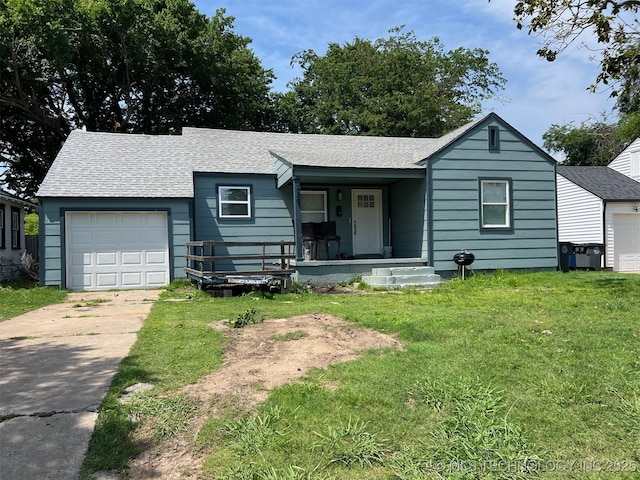 329 E Zion Pl, Tulsa, OK 74106 - single story home with roof with shingles, driveway, a porch, an attached garage, and a front yard