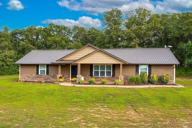 23997 County Road 1475th Loop, Ada, OK 74820 - view of front facade featuring stone siding, a front yard, a porch, and a metal roof