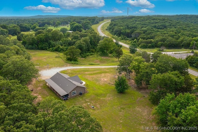 23997 County Road 1475th Loop, Ada, OK 74820 - aerial view of property and surrounding area with a heavily wooded area