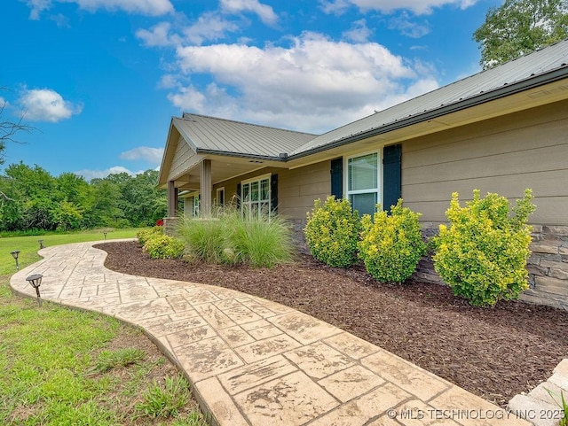 23997 County Road 1475th Loop, Ada, OK 74820 - view of side of home with a metal roof