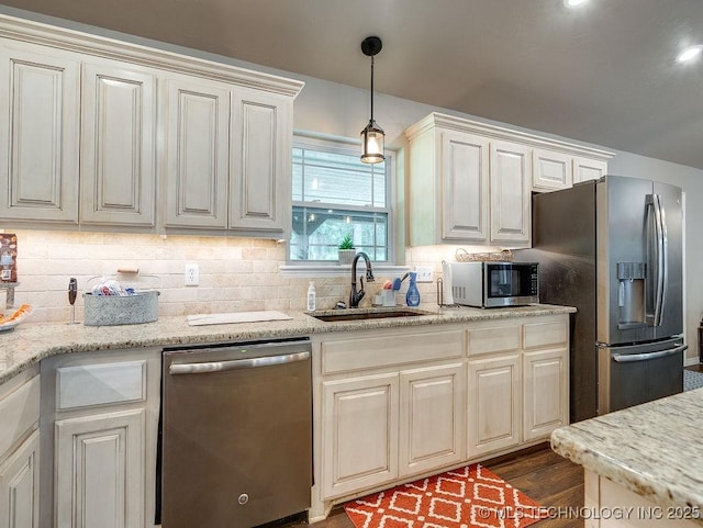 23997 County Road 1475th Loop, Ada, OK 74820 - kitchen featuring appliances with stainless steel finishes, decorative backsplash, pendant lighting, and dark wood finished floors