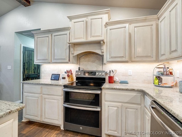 23997 County Road 1475th Loop, Ada, OK 74820 - kitchen with appliances with stainless steel finishes, dark wood-style floors, decorative backsplash, and light stone countertops