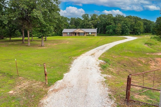 23997 County Road 1475th Loop, Ada, OK 74820 - surrounding community with driveway and a wooded view