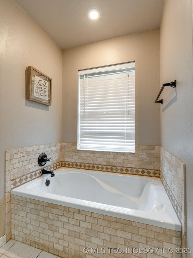 23997 County Road 1475th Loop, Ada, OK 74820 - full bath with a garden tub and tile patterned flooring