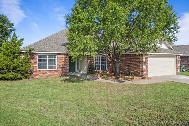13124 N 133rd E Ave, Collinsville, OK 74021 - obstructed view of property with brick siding, roof with shingles, concrete driveway, and an attached garage