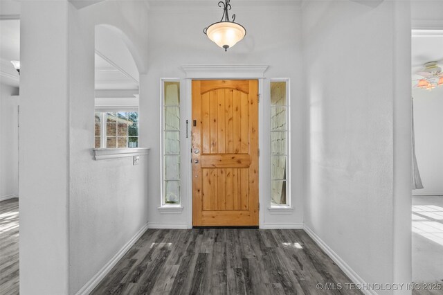13124 N 133rd E Ave, Collinsville, OK 74021 - entryway featuring dark wood-style flooring and arched walkways