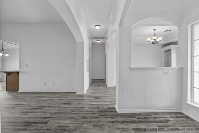 13124 N 133rd E Ave, Collinsville, OK 74021 - empty room with a chandelier and wood finished floors