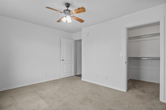 13124 N 133rd E Ave, Collinsville, OK 74021 - unfurnished bedroom featuring carpet, a walk in closet, a closet, and a ceiling fan