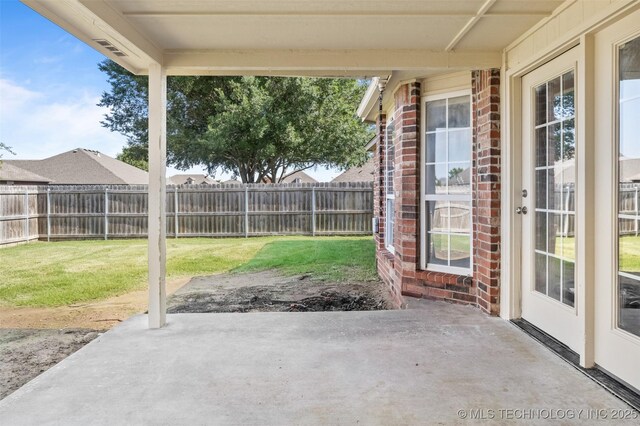 13124 N 133rd E Ave, Collinsville, OK 74021 - fenced backyard with a patio area