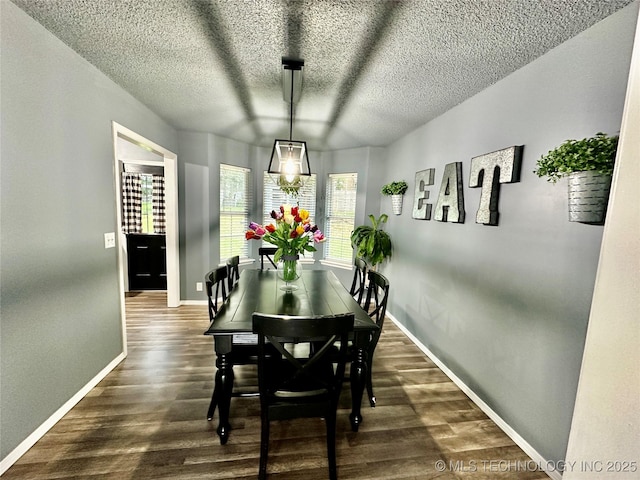 3617 S 74th W Ct, Tulsa, OK 74107 - dining area with dark wood-style flooring and a textured ceiling