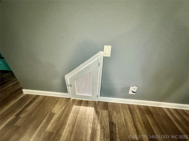 3617 S 74th W Ct, Tulsa, OK 74107 - detailed view of baseboards and wood finished floors