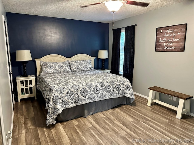 3617 S 74th W Ct, Tulsa, OK 74107 - bedroom with wood finished floors, a textured ceiling, and ceiling fan