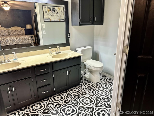 3617 S 74th W Ct, Tulsa, OK 74107 - full bath featuring double vanity, ensuite bathroom, tile patterned flooring, and ceiling fan