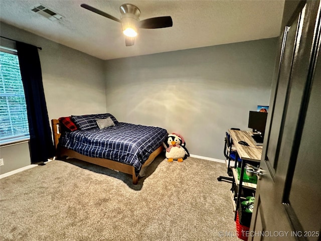 3617 S 74th W Ct, Tulsa, OK 74107 - bedroom with carpet flooring, multiple windows, a textured ceiling, and ceiling fan