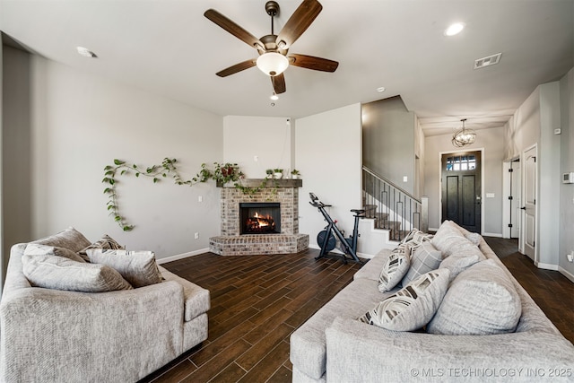 30109 Gale Ave, Inola, OK 74036 - living room with stairway, dark wood-style flooring, a ceiling fan, a brick fireplace, and recessed lighting