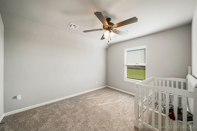 30109 Gale Ave, Inola, OK 74036 - unfurnished bedroom featuring carpet flooring, a ceiling fan, and a crib