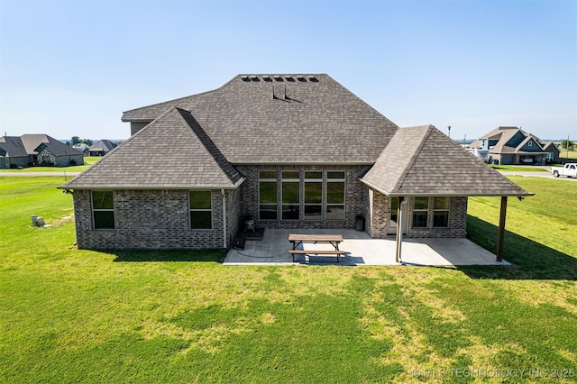 30109 Gale Ave, Inola, OK 74036 - back of property with a shingled roof, a patio area, and brick siding