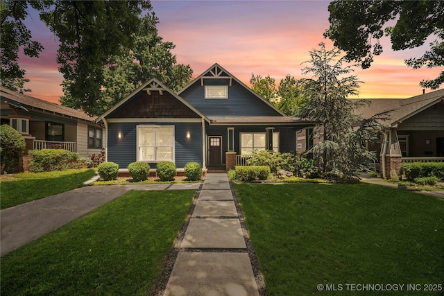1617 S St Louis Ave, Tulsa, OK 74120 - craftsman inspired home with a lawn and covered porch