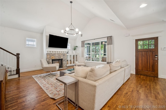 1617 S St Louis Ave, Tulsa, OK 74120 - living area with stairs, wood finished floors, a fireplace, and high vaulted ceiling
