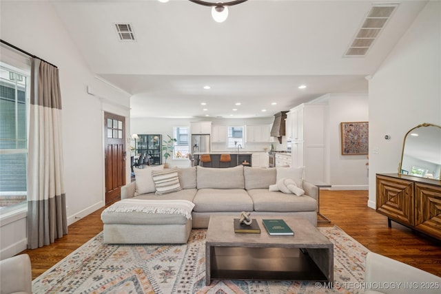 1617 S St Louis Ave, Tulsa, OK 74120 - living area featuring wood finished floors, recessed lighting, and vaulted ceiling