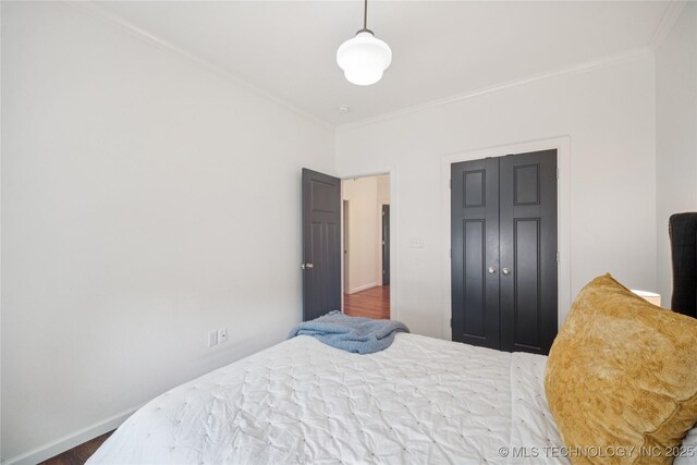 1617 S St Louis Ave, Tulsa, OK 74120 - bedroom with ornamental molding and wood finished floors