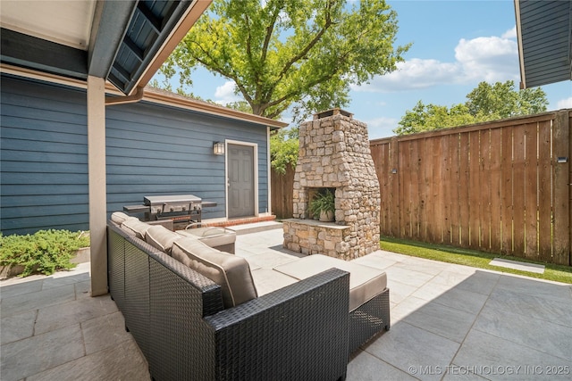 1617 S St Louis Ave, Tulsa, OK 74120 - view of patio featuring an outdoor living space with a fireplace and area for grilling
