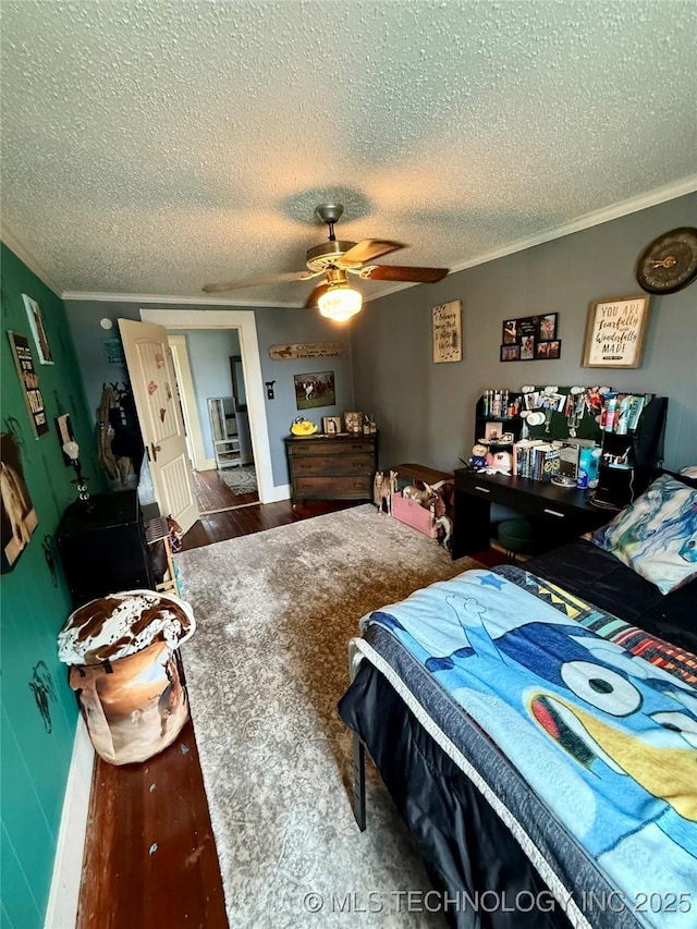 416 E 7th St, Dewey, OK 74029 - bedroom featuring crown molding, a textured ceiling, wood finished floors, and a ceiling fan