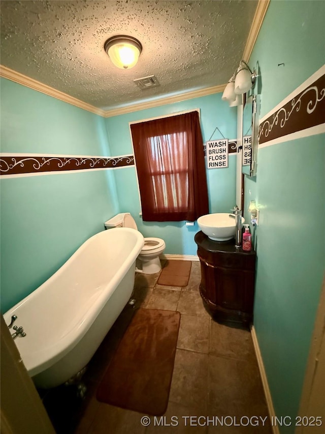 416 E 7th St, Dewey, OK 74029 - full bathroom with ornamental molding, a soaking tub, vanity, a textured ceiling, and tile patterned flooring