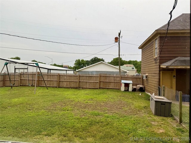 416 E 7th St, Dewey, OK 74029 - fenced backyard featuring a playground