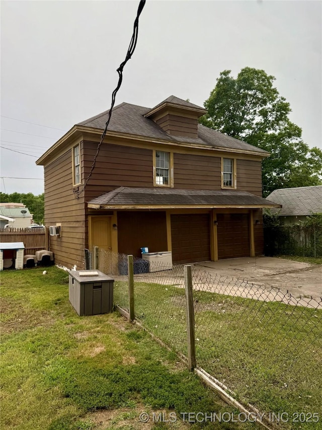 416 E 7th St, Dewey, OK 74029 - rear view of property with a garage, driveway, and roof with shingles