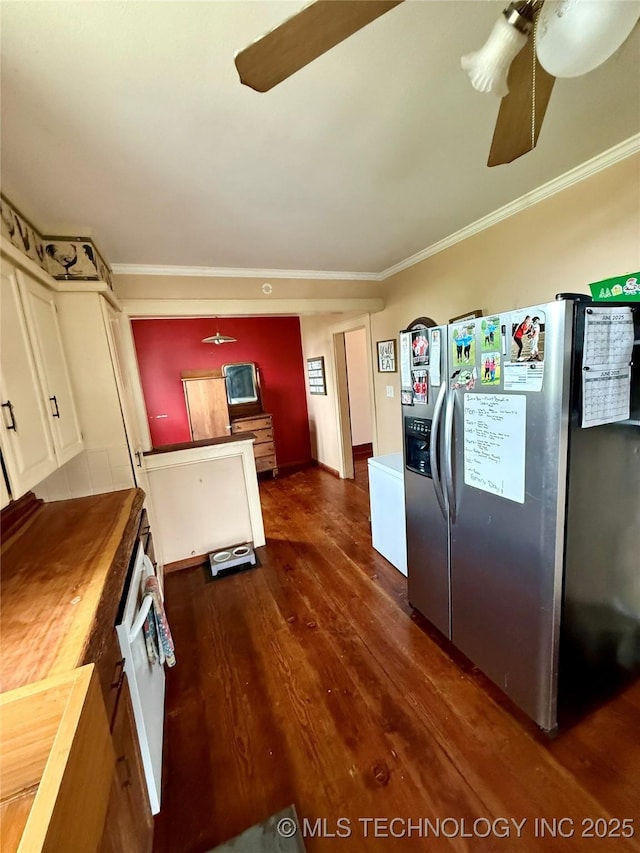 416 E 7th St, Dewey, OK 74029 - kitchen featuring stainless steel refrigerator with ice dispenser, a ceiling fan, dark wood finished floors, and ornamental molding