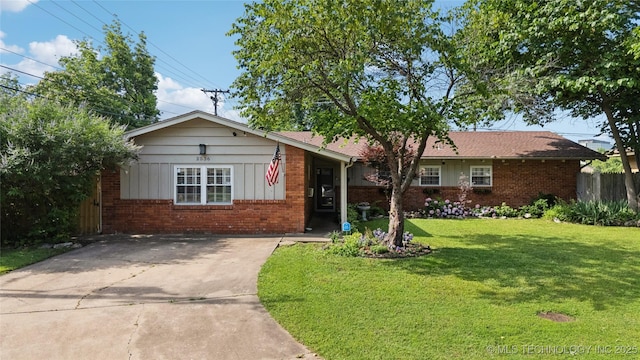 2536 E 57th St, Tulsa, OK 74105 - ranch-style house featuring brick siding and concrete driveway