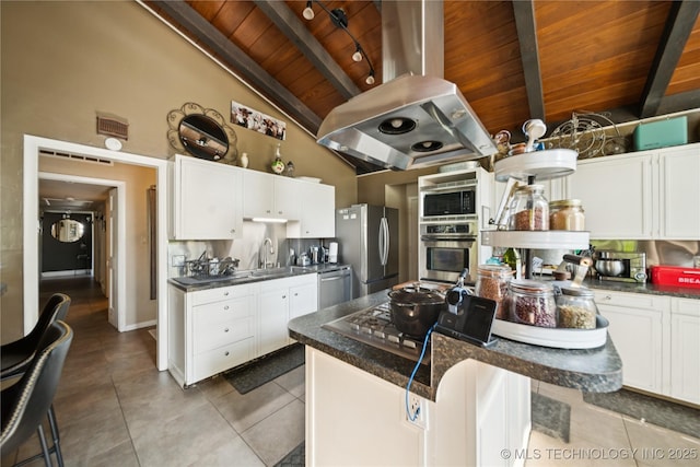 2536 E 57th St, Tulsa, OK 74105 - kitchen with wood ceiling, appliances with stainless steel finishes, island range hood, dark countertops, and light tile patterned floors
