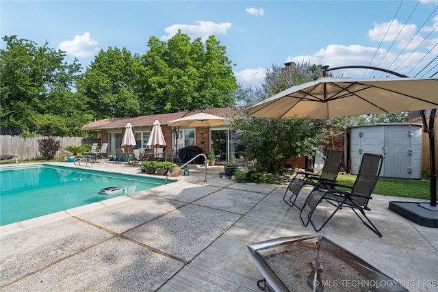 2536 E 57th St, Tulsa, OK 74105 - view of pool featuring a patio area and a storage shed