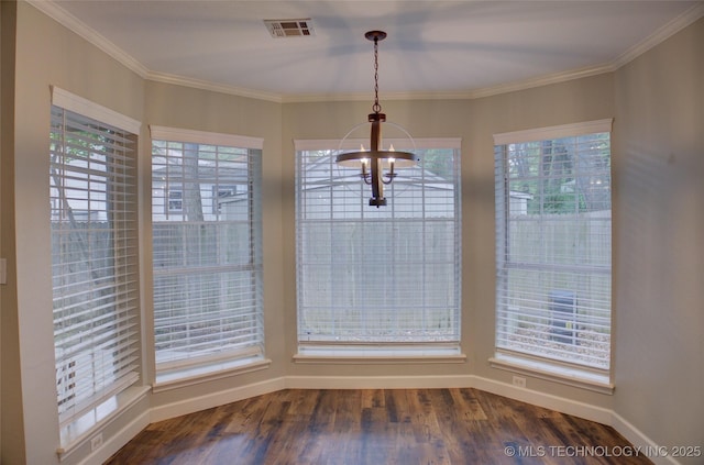 5512 S Columbia Ct, Tulsa, OK 74105 - unfurnished dining area featuring a chandelier, healthy amount of natural light, dark wood finished floors, and crown molding