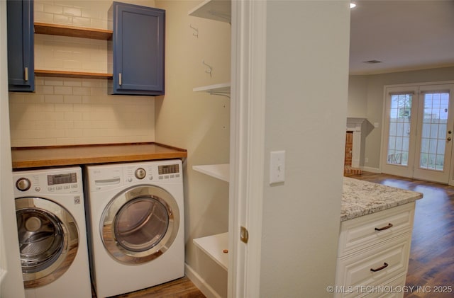 5512 S Columbia Ct, Tulsa, OK 74105 - washroom with washer and clothes dryer, cabinet space, and dark wood finished floors