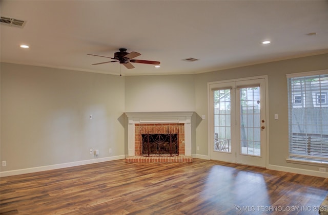 5512 S Columbia Ct, Tulsa, OK 74105 - unfurnished living room featuring wood finished floors, crown molding, a ceiling fan, a fireplace, and recessed lighting